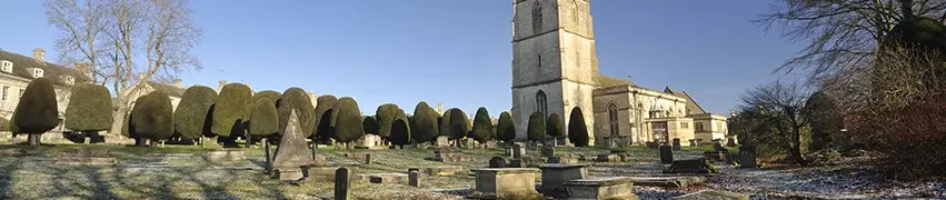 church pictured with cemetery in the cotswolds